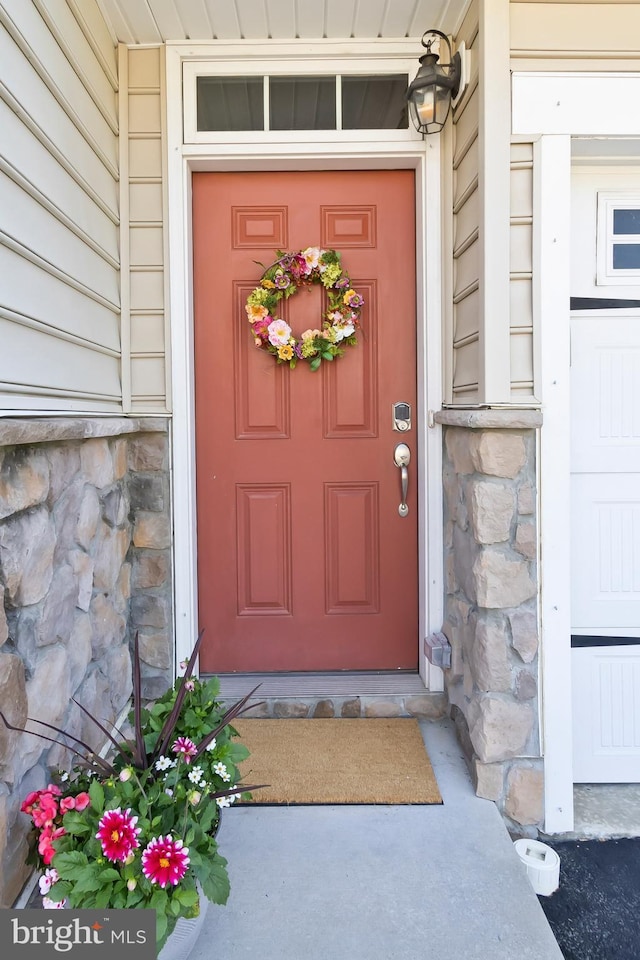 527 Jacobsen Dr, Newark, DE 19702 - entrance to property with stone siding and a porch