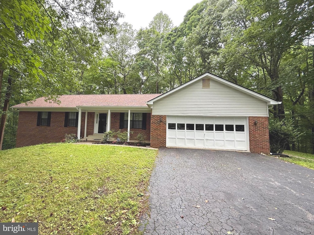 6308 Brookeview Ct, Chesapeake Beach, MD 20732 - single story home featuring brick siding, asphalt driveway, an attached garage, and a front lawn