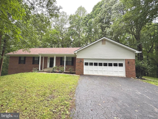 6308 Brookeview Ct, Chesapeake Beach, MD 20732 - single story home featuring brick siding, asphalt driveway, an attached garage, and a front lawn