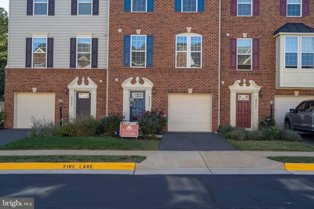 22864 Chestnut Oak Ter, Sterling, VA 20166 - view of front of property with brick siding, a garage, and driveway