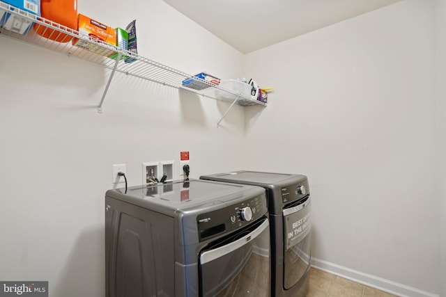 22864 Chestnut Oak Ter, Sterling, VA 20166 - laundry area with washing machine and dryer and baseboards