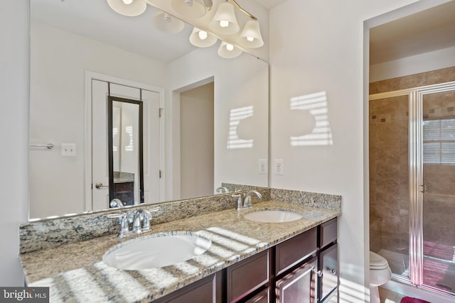 22864 Chestnut Oak Ter, Sterling, VA 20166 - bathroom featuring a stall shower, double vanity, and toilet