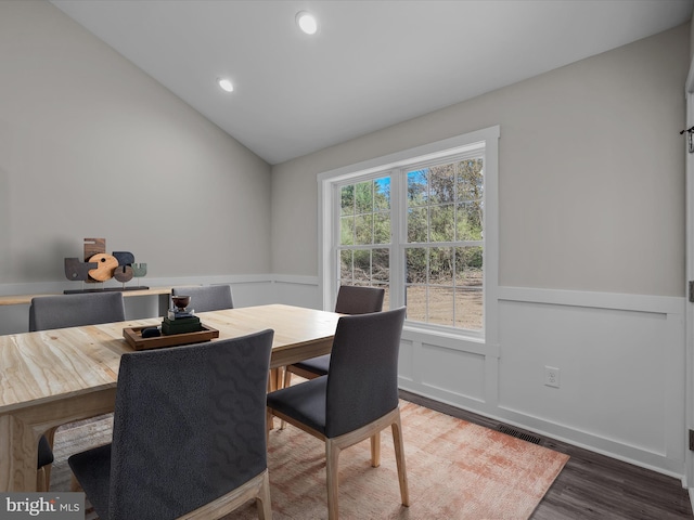 39 Mdg, Berkeley Springs, WV 25411 - dining space with wainscoting, wood finished floors, vaulted ceiling, recessed lighting, and a decorative wall