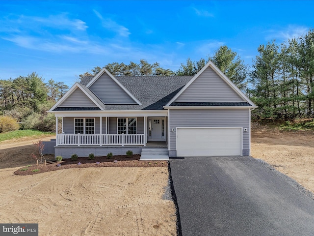 39 Mdg, Berkeley Springs, WV 25411 - view of front of home featuring asphalt driveway, roof with shingles, a porch, and an attached garage