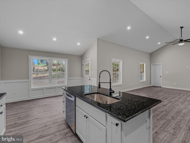 39 Mdg, Berkeley Springs, WV 25411 - kitchen with a sink, vaulted ceiling, dishwasher, light wood finished floors, and white cabinets