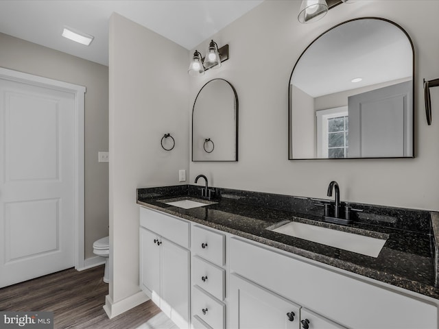 39 Mdg, Berkeley Springs, WV 25411 - full bath featuring double vanity, toilet, wood finished floors, and baseboards