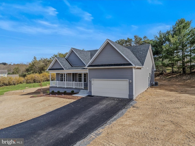 39 Mdg, Berkeley Springs, WV 25411 - view of front of home with covered porch, driveway, a garage, and roof with shingles