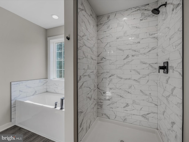39 Mdg, Berkeley Springs, WV 25411 - bathroom featuring a garden tub, a shower stall, and wood finished floors