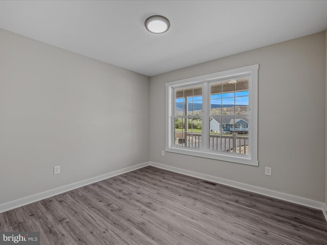 39 Mdg, Berkeley Springs, WV 25411 - spare room featuring wood finished floors and baseboards