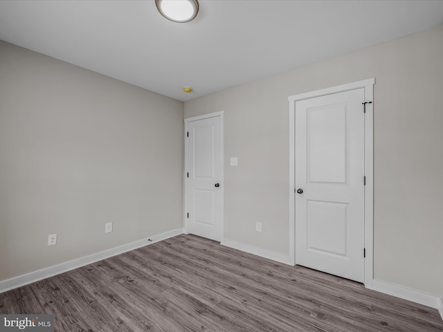 39 Mdg, Berkeley Springs, WV 25411 - unfurnished bedroom with wood finished floors and baseboards