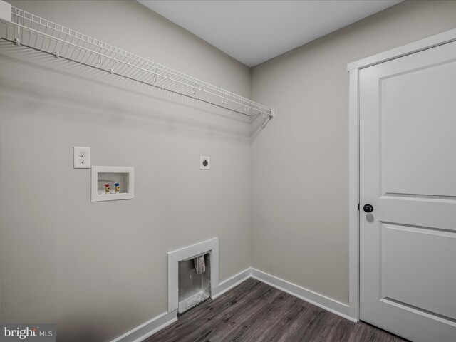 39 Mdg, Berkeley Springs, WV 25411 - laundry room with hookup for an electric dryer, dark wood-type flooring, baseboards, and washer hookup
