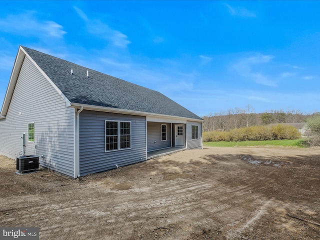 39 Mdg, Berkeley Springs, WV 25411 - back of house featuring roof with shingles and central AC