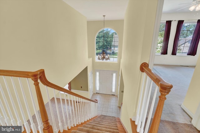 1215 Oakwood Ln, York, PA 17403 - staircase featuring healthy amount of natural light, carpet floors, a chandelier, and baseboards