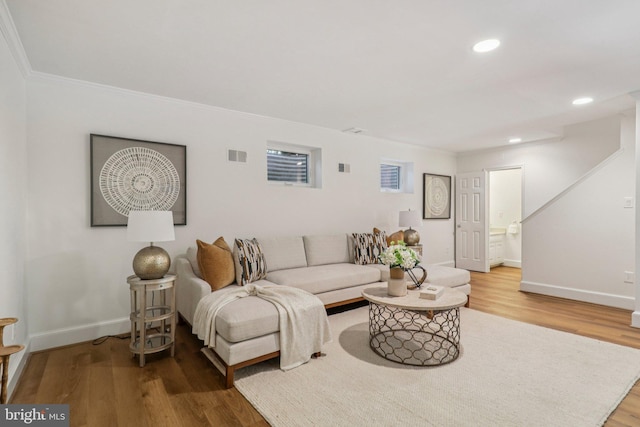 3233 Ellicott St NW, Washington, DC 20008 - living area featuring light wood-style floors, ornamental molding, recessed lighting, and baseboards