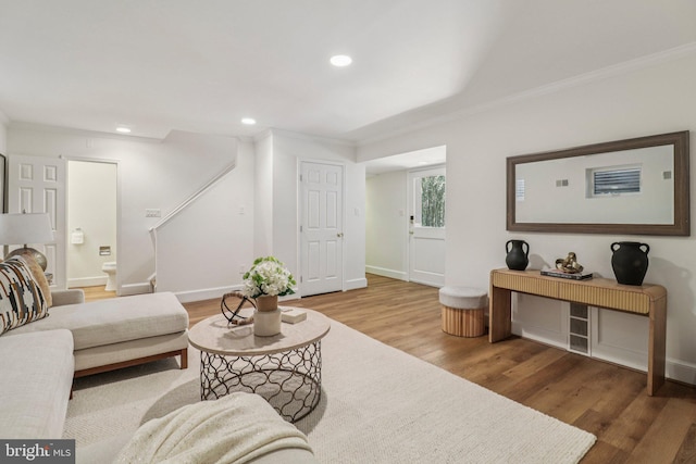 3233 Ellicott St NW, Washington, DC 20008 - living area featuring crown molding, wood finished floors, stairway, recessed lighting, and baseboards
