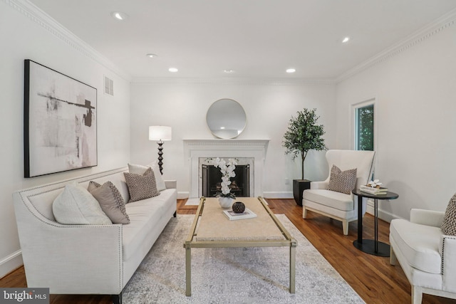 3233 Ellicott St NW, Washington, DC 20008 - living area featuring wood finished floors, ornamental molding, a premium fireplace, recessed lighting, and baseboards