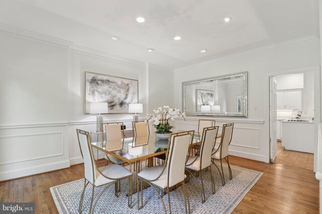 3233 Ellicott St NW, Washington, DC 20008 - dining room with ornamental molding, a decorative wall, light wood-type flooring, a wainscoted wall, and recessed lighting