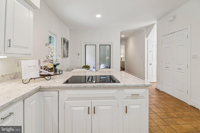 3233 Ellicott St NW, Washington, DC 20008 - kitchen featuring black electric cooktop, a peninsula, white cabinetry, and recessed lighting