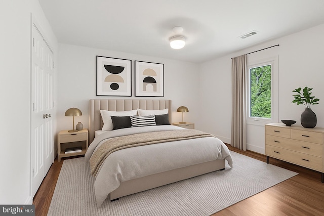 3233 Ellicott St NW, Washington, DC 20008 - bedroom featuring wood finished floors, a closet, and baseboards