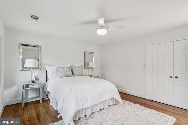 3233 Ellicott St NW, Washington, DC 20008 - bedroom with wood finished floors, a closet, baseboards, and a ceiling fan