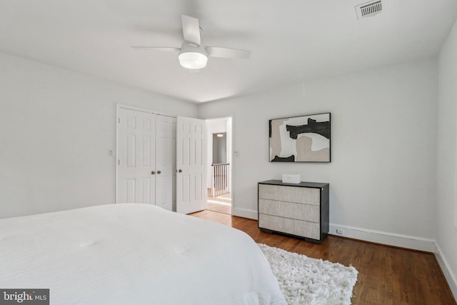 3233 Ellicott St NW, Washington, DC 20008 - bedroom featuring baseboards, wood finished floors, a closet, and ceiling fan