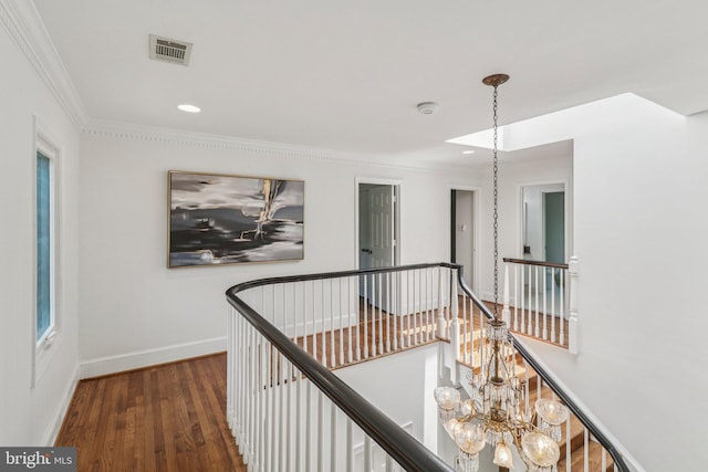 3233 Ellicott St NW, Washington, DC 20008 - hallway featuring an upstairs landing, wood finished floors, ornamental molding, baseboards, and recessed lighting