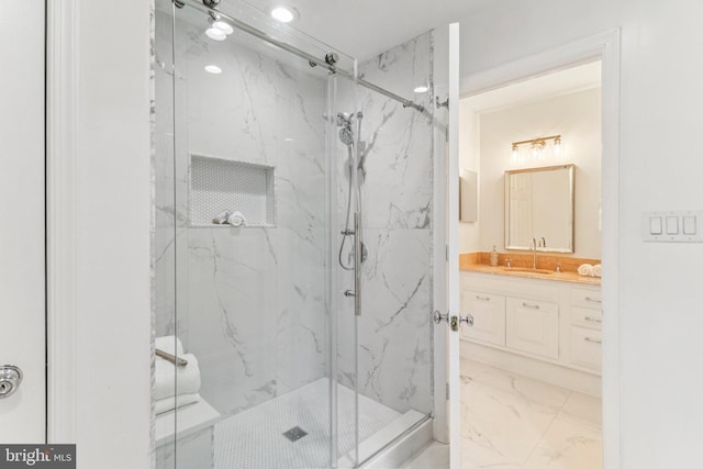 3233 Ellicott St NW, Washington, DC 20008 - full bathroom with marble look tile flooring, a marble finish shower, vanity, and recessed lighting