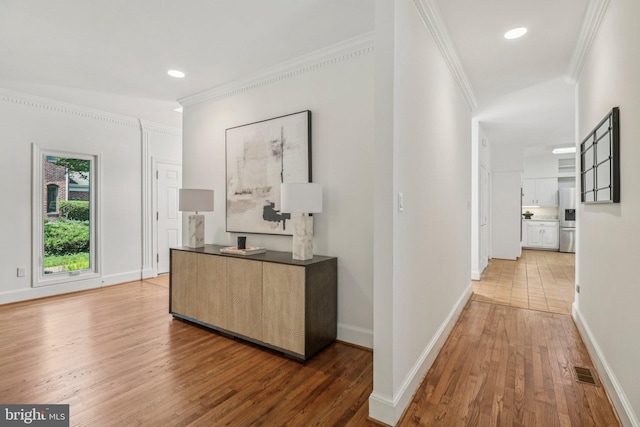 3233 Ellicott St NW, Washington, DC 20008 - hallway with crown molding, wood finished floors, baseboards, and recessed lighting
