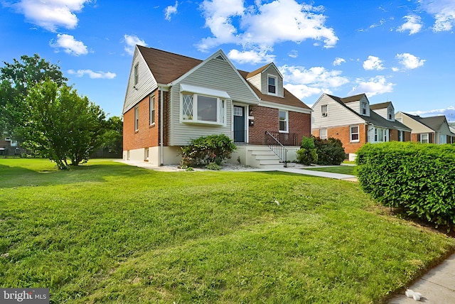 3316 Fairview Rd, Baltimore, MD 21207 - cape cod house featuring brick siding and a front yard