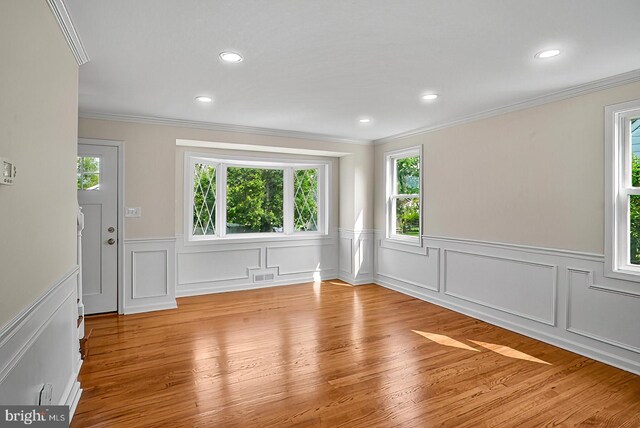 3316 Fairview Rd, Baltimore, MD 21207 - empty room featuring crown molding, plenty of natural light, wainscoting, wood finished floors, and recessed lighting