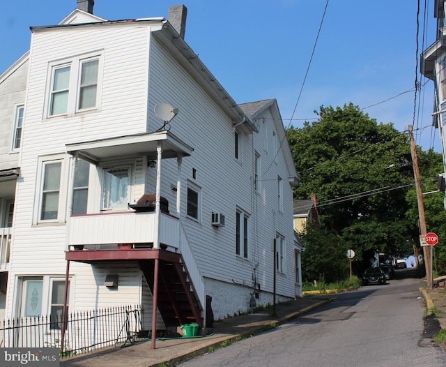 24 S 7th St, Shamokin, PA 17872 - view of home's exterior featuring a chimney and stairway