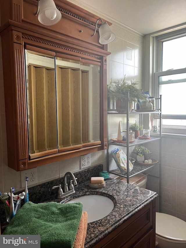 24 S 7th St, Shamokin, PA 17872 - half bath with vanity, toilet, and tile walls