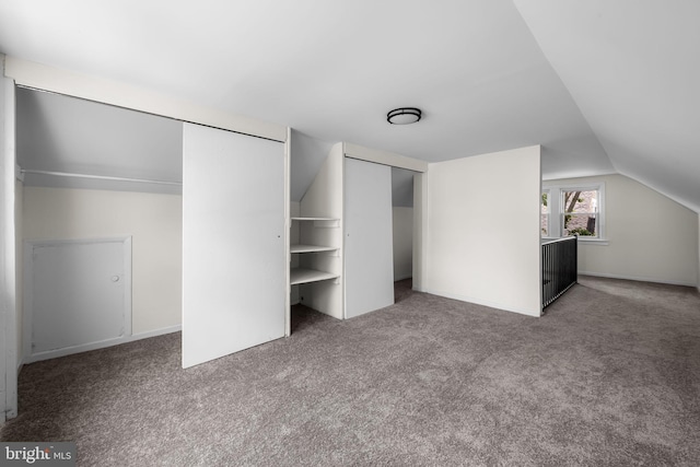 5600 Patrick Henry, Baltimore, MD 21225 - unfurnished bedroom featuring carpet floors, vaulted ceiling, and two closets