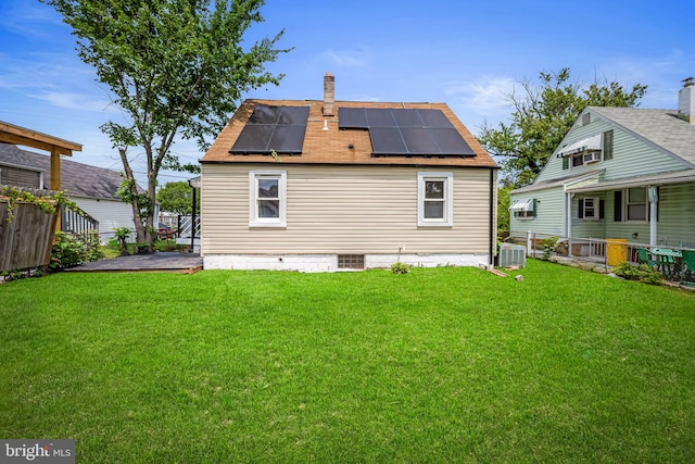 5600 Patrick Henry, Baltimore, MD 21225 - back of property with roof mounted solar panels, a chimney, and central AC unit