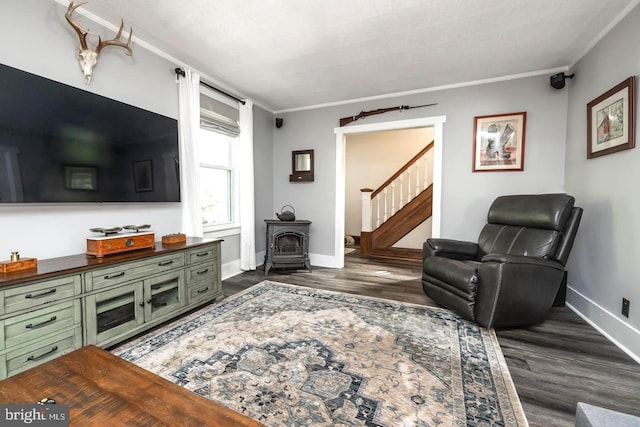 218 New Jersey Ave, Collingswood, NJ 08108 - living area featuring a wood stove, dark wood-type flooring, stairway, baseboards, and crown molding