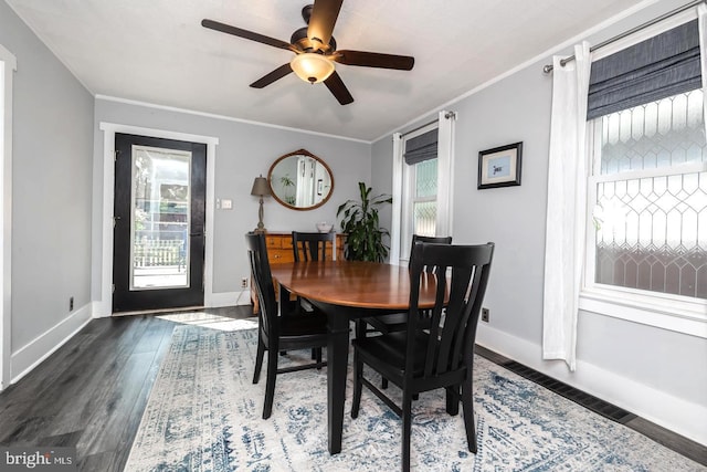 218 New Jersey Ave, Collingswood, NJ 08108 - dining space with healthy amount of natural light, a ceiling fan, wood finished floors, crown molding, and baseboards