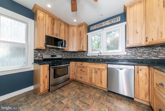 218 New Jersey Ave, Collingswood, NJ 08108 - kitchen featuring stainless steel appliances, a sink, backsplash, stone finish floors, and recessed lighting
