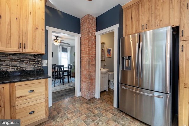 218 New Jersey Ave, Collingswood, NJ 08108 - kitchen with stainless steel refrigerator with ice dispenser, a ceiling fan, light brown cabinets, tasteful backsplash, and stone finish flooring