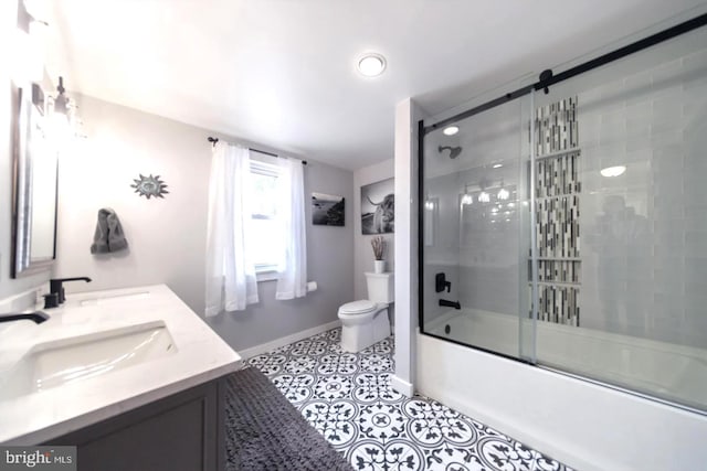 218 New Jersey Ave, Collingswood, NJ 08108 - full bathroom with toilet, baseboards, double vanity, and combined bath / shower with glass door