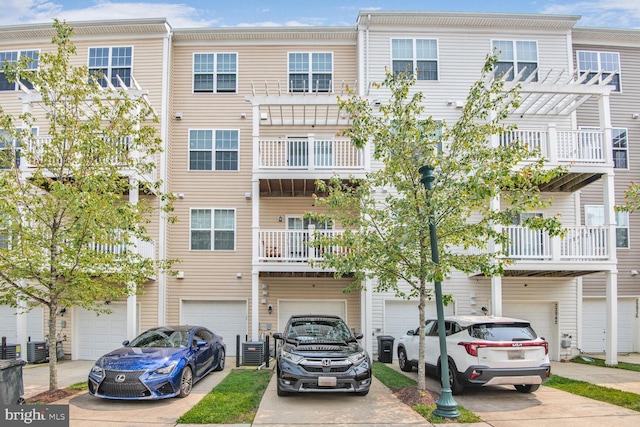 22946 Spicebush Dr Unit 1382, Clarksburg, MD 20871 - view of property with driveway, a garage, and central AC unit