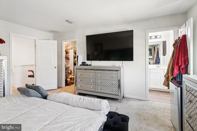 161 Ciseley Dr, Sicklerville, NJ 08081 - bedroom featuring a walk in closet, light colored carpet, a closet, and ensuite bathroom