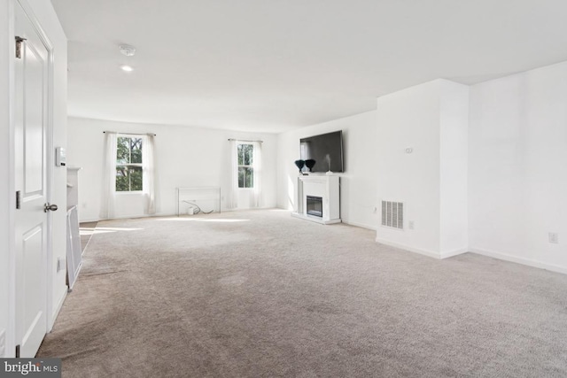 161 Ciseley Dr, Sicklerville, NJ 08081 - unfurnished living room with carpet floors and a glass covered fireplace