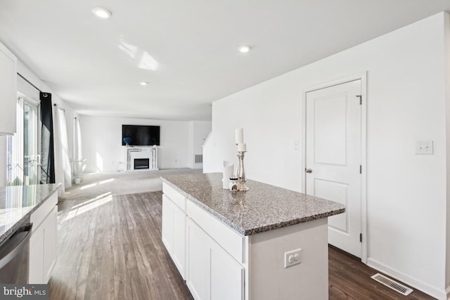 161 Ciseley Dr, Sicklerville, NJ 08081 - kitchen featuring a center island, dishwasher, dark wood-style flooring, light stone countertops, and white cabinetry