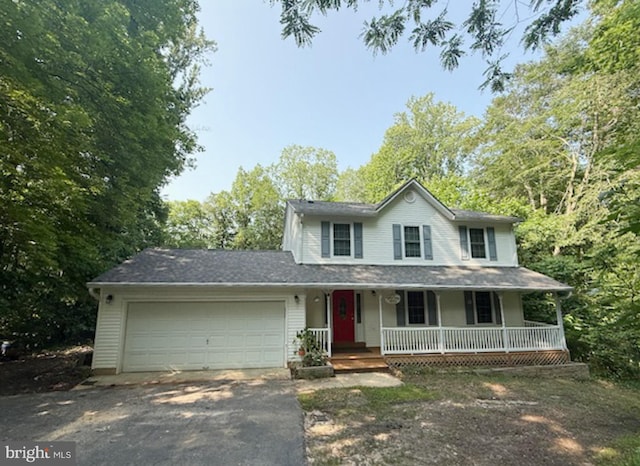 39410 Thomas Dr, Mechanicsville, MD 20659 - view of front of house featuring covered porch, driveway, and an attached garage