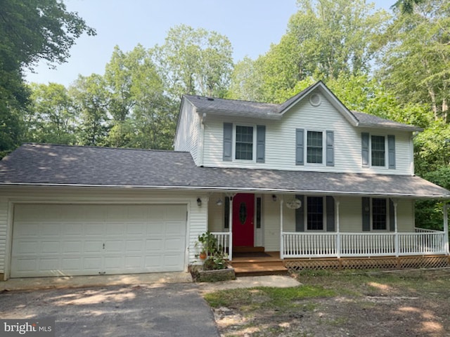 39410 Thomas Dr, Mechanicsville, MD 20659 - view of front of property with driveway, covered porch, and a garage