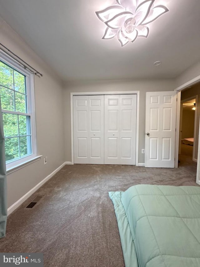 39410 Thomas Dr, Mechanicsville, MD 20659 - unfurnished bedroom with carpet flooring, a closet, and baseboards