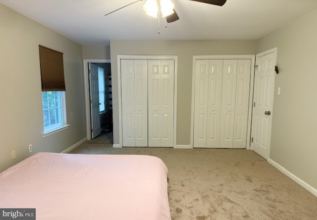 39410 Thomas Dr, Mechanicsville, MD 20659 - carpeted bedroom featuring two closets, baseboards, and a ceiling fan