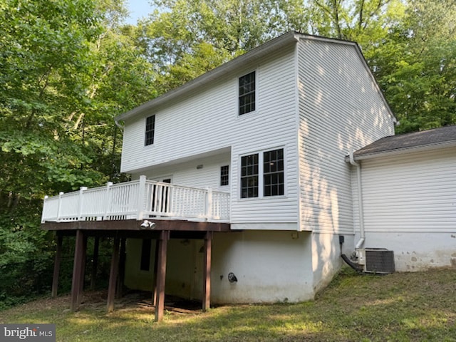 39410 Thomas Dr, Mechanicsville, MD 20659 - rear view of house with central AC unit, a wooden deck, and a yard