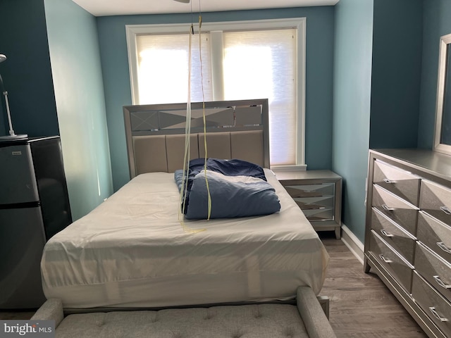 6001 N Mascher St, Philadelphia, PA 19120 - bedroom featuring wood finished floors, freestanding refrigerator, and baseboards