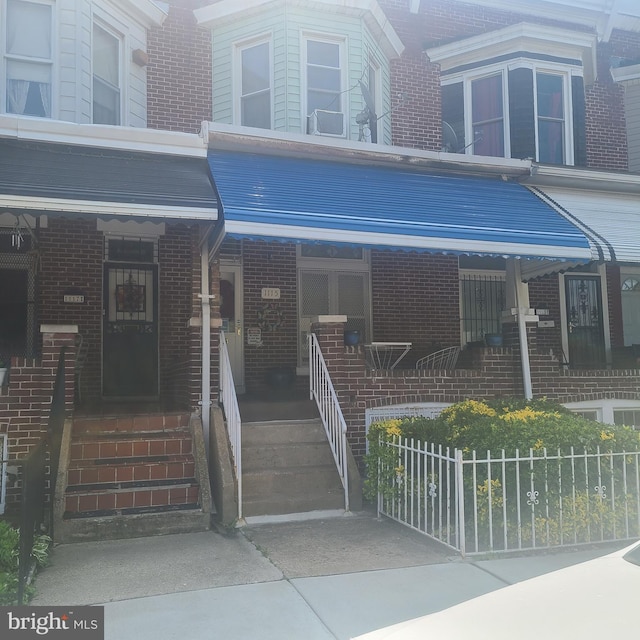 1115 Bentalou, Baltimore, MD 21216 - multi unit property featuring brick siding and covered porch